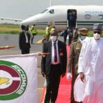 Buhari arrives Bamako, wears face mask